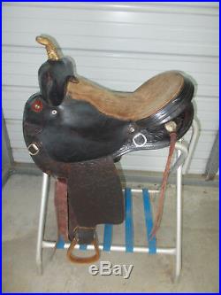 16 Black barrel saddle with tooling and a rounded skirt