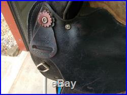 16 Black barrel saddle with tooling and a rounded skirt