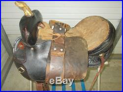 16 Black barrel saddle with tooling and a rounded skirt