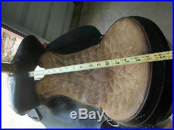 16 Black barrel saddle with tooling and a rounded skirt