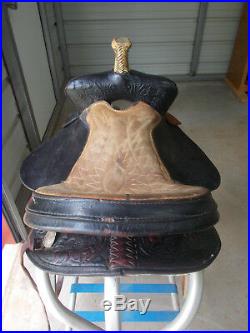 16 Black barrel saddle with tooling and a rounded skirt