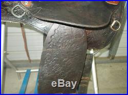 16 Black barrel saddle with tooling and a rounded skirt