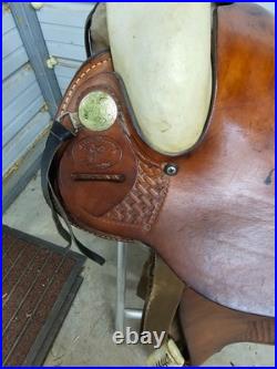 A Used 16 Dakota Saddlery Brown Color Hard Tail Slick Seat Roping Saddle