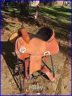Lightly used 15 inch barrel racing saddle