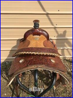 Used 16 Billy Cook Western roping saddle withtooled skirts, rough out fenders