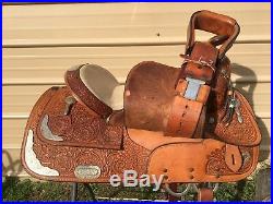 Used Circle Y 16 tooled Western show saddle withsiver for short adult or youth