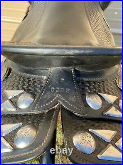 Used/vintage 15black basket stamped leather Western parade saddle withtapaderos
