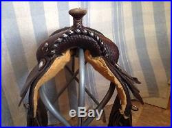 Used/vintage Circle Y 15 Western equitation saddle withsilver, tooled leather